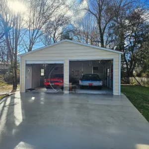 24x25 enclosed steel Garage with 14-gauge steel frame, 29-gauge panels, 2 roll-up doors (10x8), a walk-in door (36x80), and 2 windows (30x36). Designed for durability and versatility in residential, commercial, or agricultural applications."